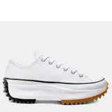 Championes Converse modelo Run Star Hike Ox, de corte bajo y diseño de plataforma dentada. Presentan una capellada de lona blanca, con suela de goma bicolor que combina negro en el talón y marrón en la puntera.