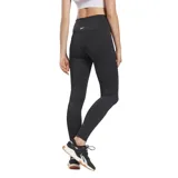Calza deportiva Reebok de tiro alto, color negro, con diseño ajustado y costuras anatómicas en las piernas.