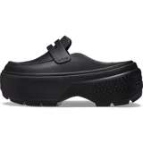 Zuecos Crocs Stomp Loafer, color blanco con suela de plataforma negra. Presentan un diseño tipo mocasín con una tira decorativa negra sobre el empeine y el logo de Crocs.