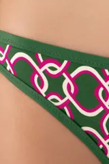 Calzón de bikini verde oscuro con estampado geométrico de círculos blancos y rosas. Tiene corte a la cadera, cobertura chica y ribete verde.