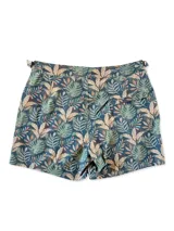 Short de baño con estampado de hojas en tonos verde, marrón y azul sobre fondo azul oscuro.
