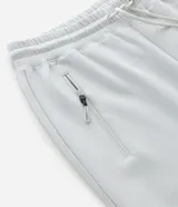 Pantalón jogger deportivo de hombre en color azul, con cintura elástica ajustable con cordón, bolsillos laterales con cierre de cremallera y bajo ajustado con puño elastizado.