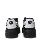 Championes urbanos Puma modelo Karmen II Idol Metallic, color negro con detalle de franja lateral plateada metalizada. Presentan una suela de plataforma robusta y diseño de caña baja.