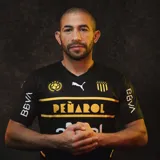 Camiseta de fútbol Puma del Club Atlético Peñarol, color negro con detalles en amarillo y blanco. Incluye logo de Puma, escudo del club, sponsor Antel y BBVA.