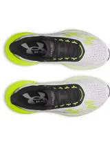 Championes de running Under Armour modelo Velociti Distance, con tecnología de amortiguación HOVR+ de longitud completa. Presentan un diseño en color blanco con detalles en amarillo neón y negro, parte superior de malla transpirable y suela de alto rendimiento.