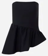 Blusa peplum sin tirantes de color negro, confeccionada en bengalina con diseño asimétrico en el dobladillo.