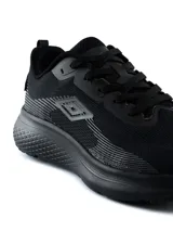 Championes de running Umbro modelo Bron, color azul marino con detalles en celeste, suela blanca gruesa y suela exterior de goma color tostado.