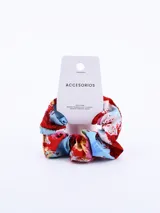 Colero de tela con estampado abstracto en tonos rojo, azul y blanco.