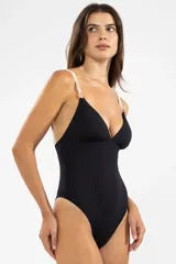 Malla entera de lycra negra con textura acanalada, escote en V y breteles finos blancos con apliques dorados.