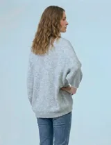 Cardigan de tejido suave con frente abierto y mangas amplias de corte holgado.
