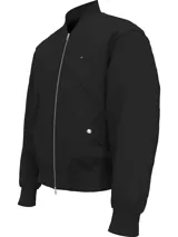 Campera bomber negra Tommy Hilfiger con cuello, puños y bajo de punto canalé. Tiene cierre de cremallera, dos bolsillos ribeteados en la cintura con botones de presión y logo de Tommy Hilfiger bordado en el pecho.