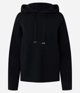 Buzo de punto con capucha y cordones ajustables con punteras metálicas. Presenta un diseño de corte regular, confeccionado en una mezcla de viscosa, poliéster y poliamida, ofreciendo una textura suave y cómoda.