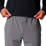 Pantalón jogger Columbia Hike Jogger Omni-Shield de color gris, con cintura elástica y cordón ajustable, bolsillos delanteros, dobladillos elásticos y bolsillo trasero con cierre. Incorpora tecnología Omni-SHIELD resistente al agua y a las manchas, y detalles reflectantes.