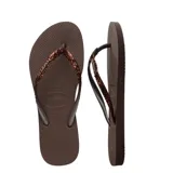 Sandalias tipo ojotas Havaianas modelo Slim Glitter II, color beige arena, con tiras finas cubiertas de glitter brillante.