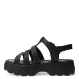 Sandalias tipo franciscana de cuero negro con plataforma dentada y cierre de hebilla lateral.