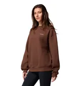 Buzo de cuello redondo Columbia, color marrón tabaco, con corte oversize, mangas largas y puños y dobladillo acanalados. Presenta el logo de la marca bordado en el pecho.