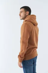 Buzo blanco de algodón con capucha y bolsillo tipo canguro. Estampado frontal con el logo de la marca y una imagen del puente de Brooklyn.