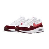 Championes Nike Air Max SC con diseño deportivo, cuerpo blanco con superposiciones de gamuza en color bordó y logo lateral en tono rosado. Cuenta con unidad de aire visible en la entresuela.
