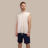 Musculosa beige de algodón con efecto acid wash y corte holgado.