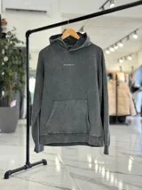 Canguro oversize de color marrón, con capucha y estampa en la espalda con el texto "Official Member of Top Style Club".