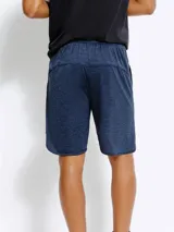 Short deportivo azul oscuro jaspeado, con cintura elástica y aberturas redondeadas en los laterales.