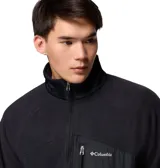 Campera de polar Columbia con cierre frontal completo, cuello alto y bolsillo vertical con cierre en el pecho. Presenta un diseño técnico con paneles superpuestos y ribetes elásticos en puños y dobladillo.