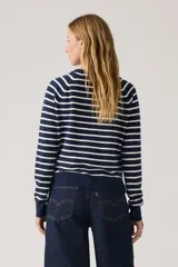 Pullover de punto con cuello en V, color azul marino con rayas horizontales blancas. Tiene mangas largas y puños acanalados.