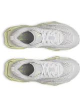 Championes deportivos blancos con detalles en gris claro y suela de color verde lima. Presentan un diseño de malla transpirable y una suela con tecnología HOVR+ para mayor amortiguación y retorno de energía.