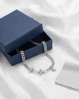 Pulsera de plata italiana 925, compuesta por una cadena de eslabones finos y una sección de esferas metálicas, con un dije colgante en forma de estrella.