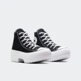 Championes Converse Chuck Taylor All Star de caña alta, color negro, con cordones blancos y suela de plataforma blanca con diseño dentado.