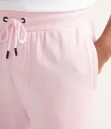Pantalón deportivo de algodón y poliéster color rosa claro, con cordón ajustable en la cintura y puños elásticos en los tobillos.