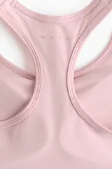 Top deportivo color rosado, con diseño de espalda nadadora y breteles anchos. Confeccionado en tejido funcional con tecnología SoftMove y DryMove, con soporte medio y elástico revestido en la base.