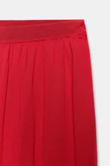 Pantalón bombacho de punto color rojo, con cintura elástica y perneras abullonadas acabadas en puño ajustado.