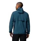 Campera cortaviento Columbia Trailborne Jacket Omni-Shield, color azul, con capucha incorporada, cierre frontal y bolsillos laterales con cremallera. Incorpora tecnología repelente a la humedad y manchas.