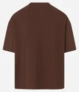 Remera de algodón con cuello redondo y mangas cortas, de corte overboxy holgado y diseño liso.