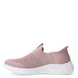 Championes deportivos Umbro modelo Flex Lady, de diseño slip-on sin cordones, confeccionados en tejido de punto elástico color rosado con suela blanca de goma texturizada.