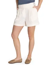 Short de tiro alto confeccionado en lino orgánico, con diseño de cintura cruzada, hebillas laterales ajustables, pinzas frontales y ruedo con dobladillo.