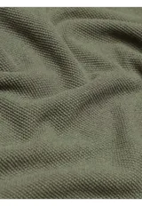 Remera de punto de manga corta y cuello redondo, confeccionada en mezcla de algodón y lino.