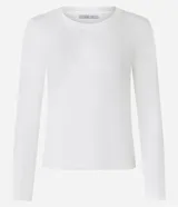 Blusa de algodón color negro, de corte ajustado, con cuello redondo y mangas largas.