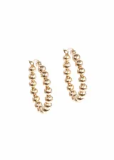 Par de aros dorados tipo argolla, con esferas pequeñas a lo largo de todo el aro.