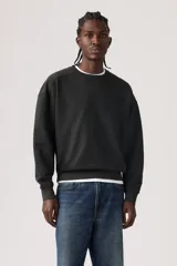 Buzo de cuello redondo con detalle de costura triangular en el escote, mangas largas con puños acanalados y dobladillo inferior elástico. Presenta un corte relajado y diseño minimalista.