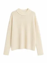 Buzo de tejido de punto en color beige, con cuello redondo acanalado, mangas largas y corte holgado.