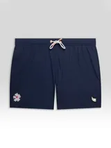 Short de baño azul marino con cintura elástica y cordón blanco con detalles en cobre. Presenta un parche bordado con una flor blanca y roja en la pierna izquierda y un parche con logo en la pierna derecha.