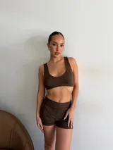 Remerón negro de tul transparente, de manga corta y corte oversize con largo midi.