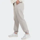 Pantalón de jogging Reebok de mujer, color gris claro, con puños elásticos, corte holgado y logo Vector bordado.