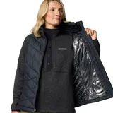 Chaleco Columbia Heavenly II de color negro, con diseño acolchado y tecnología termorreflectante Omni-Heat. Cuenta con cierre frontal de dos vías, cuello alto forrado y bolsillos laterales con cierre.
