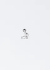 Piercing de acero quirúrgico hipoalergénico color plateado, con dos alas con zirconias blancas.