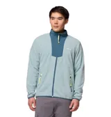 Campera polar con cierre frontal completo, cuello alto y paneles de contraste en color azul oscuro. Cuenta con bolsillos laterales con cierre y detalles en color amarillo neón en los tiradores.