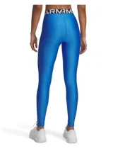 Calza deportiva Under Armour de la línea HeatGear, color azul vibrante. Presenta un diseño ajustado con cintura elástica ancha con el logo de la marca visible y logo pequeño en la pierna derecha. Confeccionada en tejido elástico de secado rápido.