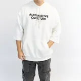 Canguro blanco de algodón con capucha, corte oversize, mangas 3/4 y estampado con texto en el frente.